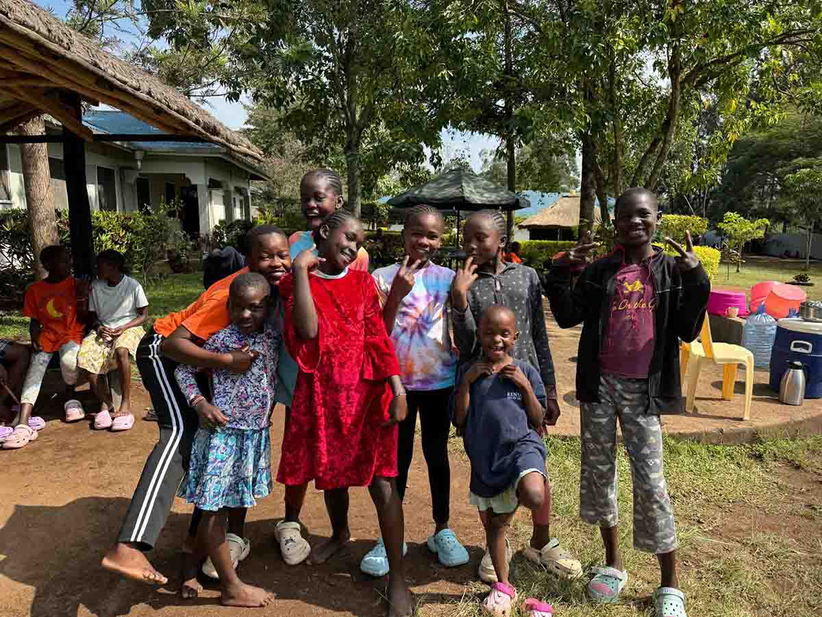 Children from the Kenya Relief community in Migori, Kenya standing together outdoors