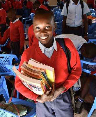 A smiling student at Kenya Relief Academy representing the Residential Children’s Home program.
